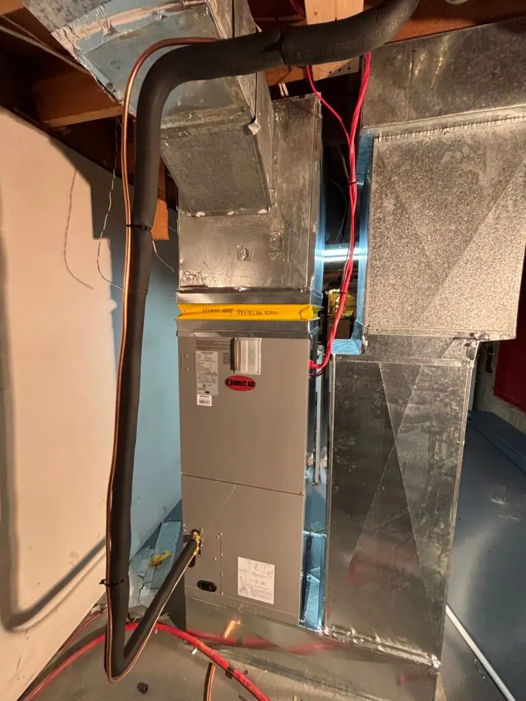 Ducted heat pump air handler connected to existing basement ductwork