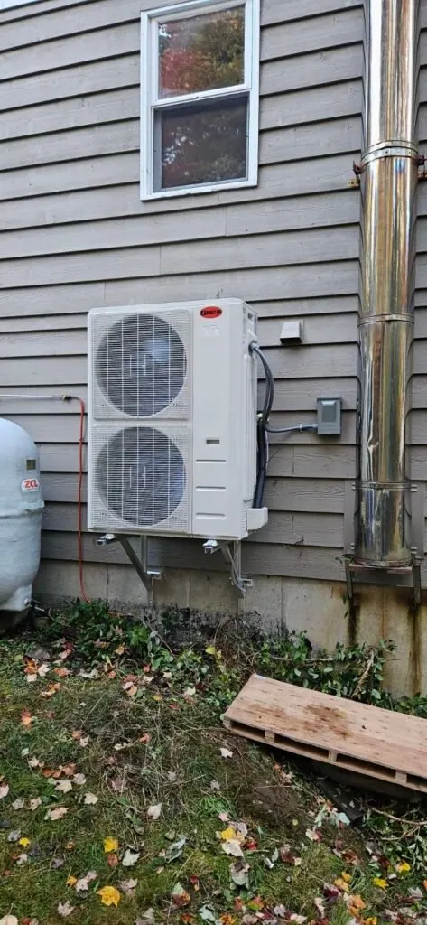 Heat pump outdoor unit replacing an oil tank heating system